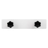 Back view of a letterblox letterbox blanking plate showing two black star-shaped knobs on a white background