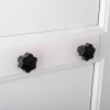 Close up of installed letterblox letterbox blanking plates in white with black knobs on a door panel
