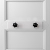 letterblox letterbox blanking plate installed on a white door back with two black screws visible