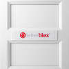 letterblox letterbox blanking plates installed on a white door panel with logo visible in the centre