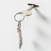 Keys hanging from a lock showing the de raat protector mp1 deposit safe key lock on a white background