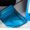 Blue collection bag with a zip, part of the de raat protector mp3 deposit safe electronic lock system