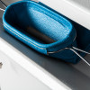 Close up of a blue collection bag inside a de raat protector mp3 deposit safe key lock