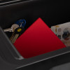 Closeup of contents inside a sentry safe fireproof waterproof box paper digital media including keys red folder and documents
