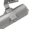 Closeup of the adjuster on a dorma door closer showing the metallic finish and bolt details