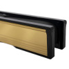Close up end view of gold 12 inch intumescent letter plate showing gold panel and black outer edge