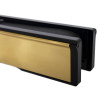 Close up end view of polished brass 12 inch intumescent letter plate showing shiny metal and black frame details