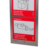 Close-up of the bottom part of a stainless steel fire blanket sign showing fire safety instructions with an illustration of a person wrapped in a blanket