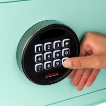 Close up of code lock keypad on phoenix dream series mint showing a finger pressing a button
