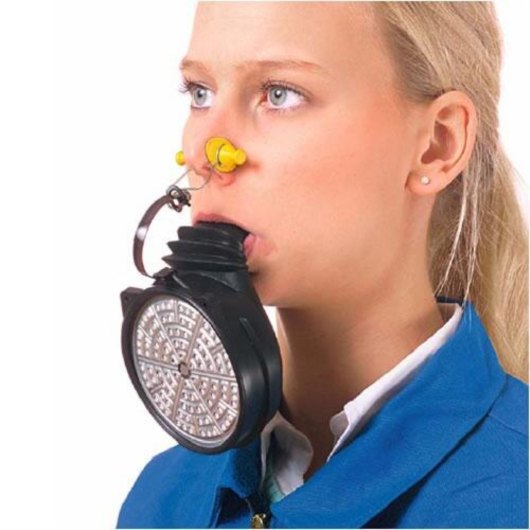 Person wearing a draeger 3200 fire escape mouth piece showing signs of wear on the device around the mouth and nose area