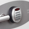 Close up of the keypad and handle on the phoenix combi 2501 electronic lock showing red numbers on the display