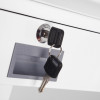 Keys inserted into a lock on a drawer associated with the phoenix combi 2501 fingerprint lock
