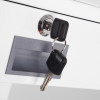 Keys in a lock of the phoenix combi 2501 key lock showing two black keys on a keyring inserted into a metal lock