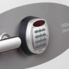 close up of a keypad lock with numbered buttons and a red digital display showing numbers