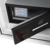internal door open showing its black inside and handle with items visible through the opening
