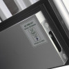 Close-up of the edge and latch mechanism of an internal door showing a label and metal fitting