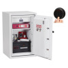 Open with lock showing a white safe opened with items inside and a keypad being used to enter a code
