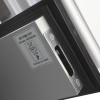 Close up of the edge and lock mechanism of an internal door showing a metal plate and label on the side panel
