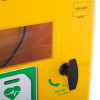 Black handle on a yellow polycarbonate outdoor defibrillator cabinet heating light showing part of the front panel and warning labels