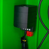 black heater attached inside a polycarbonate outdoor defibrillator cabinet heating light green