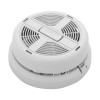 Angled view of a smoke alarm showing the rounded front grille and the mounting plate beneath it.