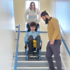 Evac chair 300h evacuation chair in use by two people moving a person down stairs