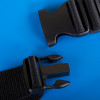 Close up of black plastic buckle and strap from evac chair comfy seat belt on a blue background