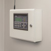 Zerio plus 8 zone control panel installed on wall viewed from an angled side perspective