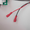 Close-up of red and black power wires inside the zerio plus 8 zone control panel