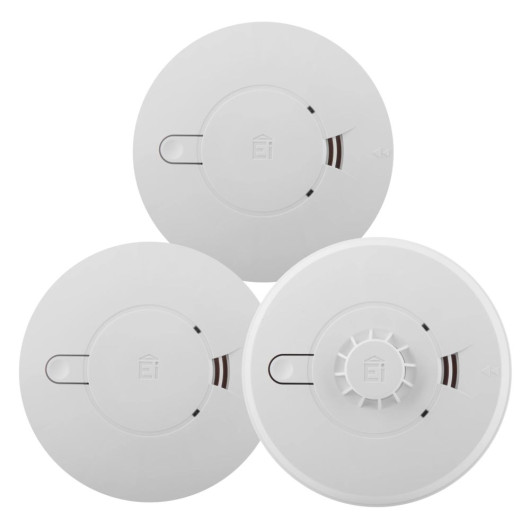 Three Ei-branded round alarms with central circular housings, including a heat alarm with a distinctive vented centre.