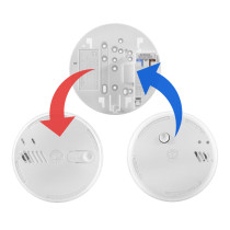 Front view of replacement mains powered smoke alarm showing the main circular unit with button and vents
