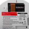 Closeup of the back of an aico mains powered heat alarm alkaline battery backup showing the battery compartment and warning label