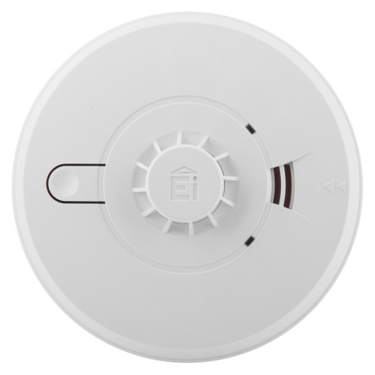 Front view of aico mains powered heat alarm alkaline battery backup showing circular white device with central sensor and indicator slots