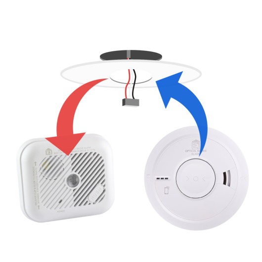 Front view of replacement mains powered smoke alarm showing the circular device with buttons and vents