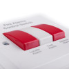 Close up of 230v remote locate silence and test control switch showing red and white buttons labeled for alarm functions