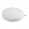 Close up of the round white pad part of the radio interlinked strobe and vibration pad with a cable attached