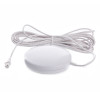 White round pad connected to a long white cable from the radio interlinked strobe and vibration pad product