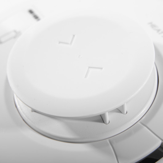 Close up detail of the aico mains powered heat alarm self charging 10yr battery backup showing the top vents and surface texture