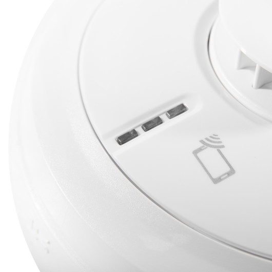Close up of indicators on aico mains powered heat alarm self charging 10yr battery backup