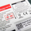 Close-up of a label on aico mains powered heat alarm self charging 10yr battery backup with usage and safety information