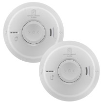 Two round white Aico Ei3000 Series alarms, featuring circular test buttons and distinct vented sensor areas for smoke and heat detection.
