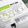 Close-up of label on aico mains powered optical smoke alarm self charging 10yr battery backup showing warnings and replacement info