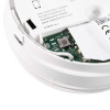 Close-up of the connection wiring and circuit board inside an optical smoke alarm 10yr longlife