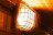 emergency light with vandal cage over the top in a corridor