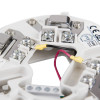 Closeup of hochiki esp short circuit isolator base showing wiring terminals and mounting screws