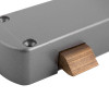 Close up of the latch part on an exidor 296 single door panic bar showing the metal finish and screws