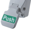 Closeup of lever on exidor single door push pad latch showing push label in green and white