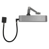 exidor 9870 electro hydraulic door closer in silver with a radius front and attached black cable on a white background
