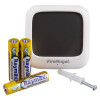 A FireAngel temperature and humidity sensor shown with three AAA alkaline batteries and a wall plug with screw