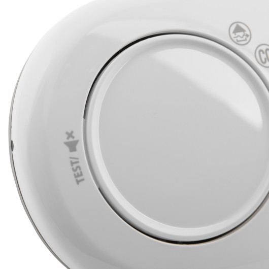 Close-up of the button on the fireangel carbon monoxide alarm 10yr long life battery showing test label and central press area